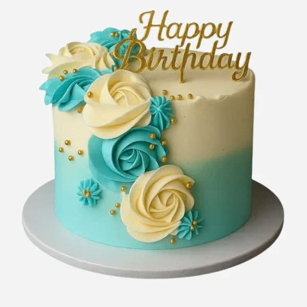 Birthday cake with blue and white flowers and 'Happy Birthday' topper on a white background