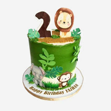 Children's birthday cake with animal-themed decorations on a white background