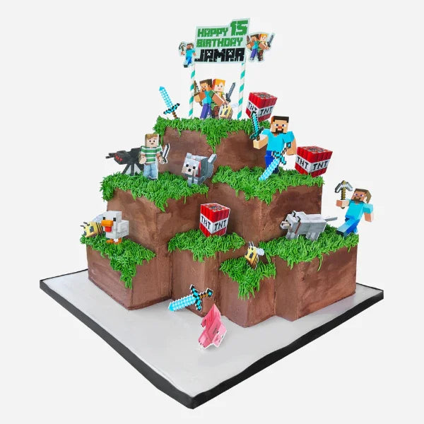 Minecraft-themed birthday cake with character figures and 'Happy 15th Birthday Jamira' text on a white background.