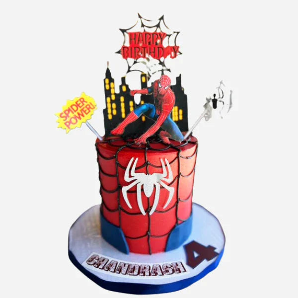 Spider-Man themed birthday cake with decorative elements on a white background